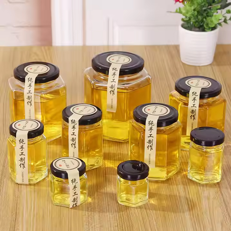 Custom logo 45ml 100ml 180ml 280ml 380ml 480ml jam sauce storage jar clear hexagon glass honey jar with lug lid and dipper